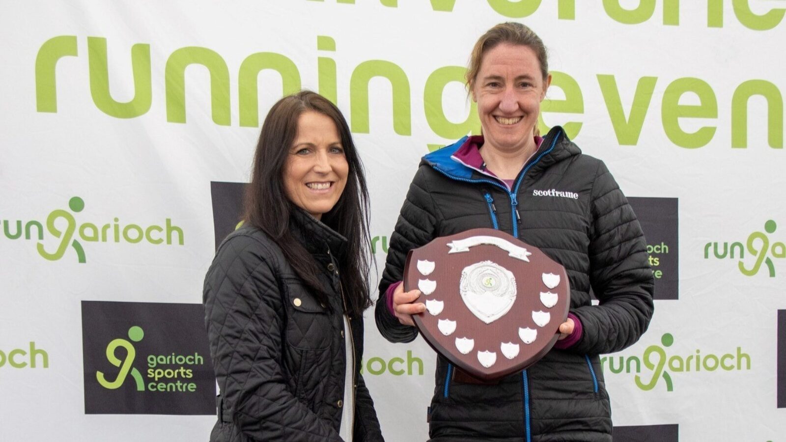 Claire Bathgate of Dandara (left) presenting Nicola Gauld of Scotframe (right) with the 2023 AB51 Business Challenge Shield